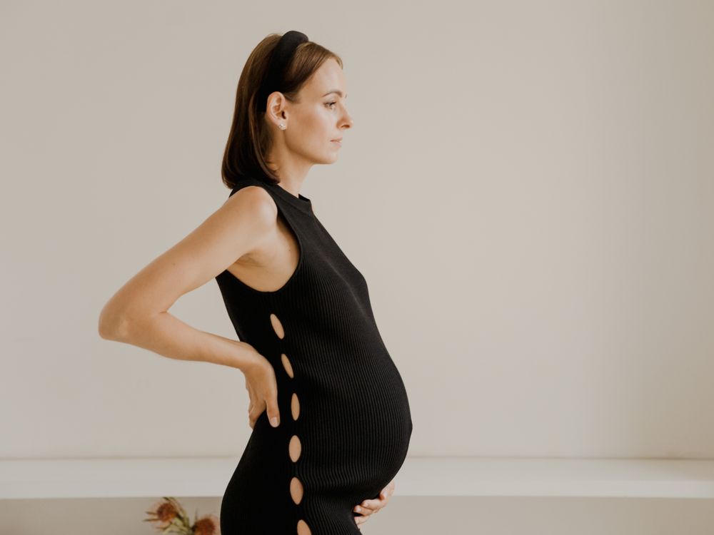 Side profile with hands on bump